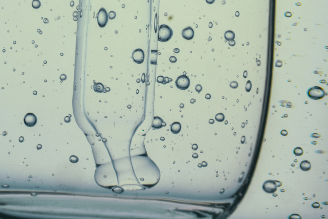 A pipette in clear serum.