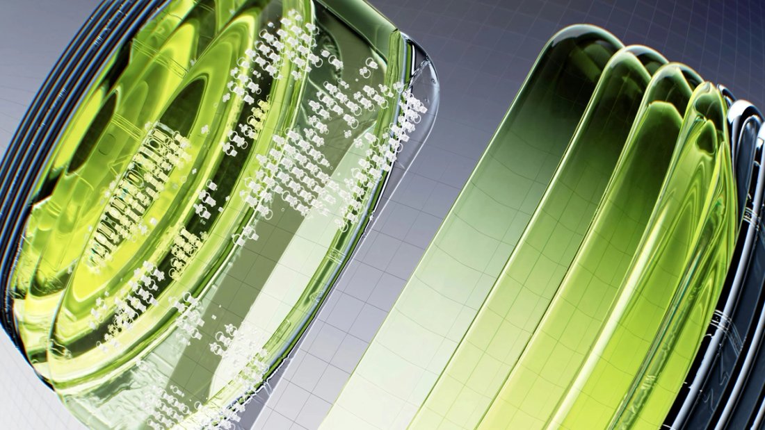 A closeup of a green translucent object on a grey background.