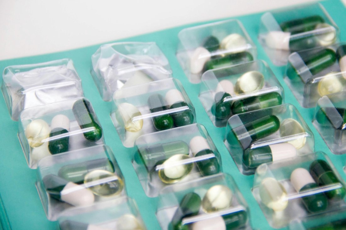 A green blister pack of pills.