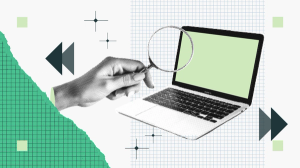 Hand holding a magnifying glass over an open laptop with a green screen, set against a grid-patterned background with geometric accents.