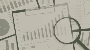Businesswoman smiling next to an image of charts and graphs with a magnifying glass, symbolizing data analysis.