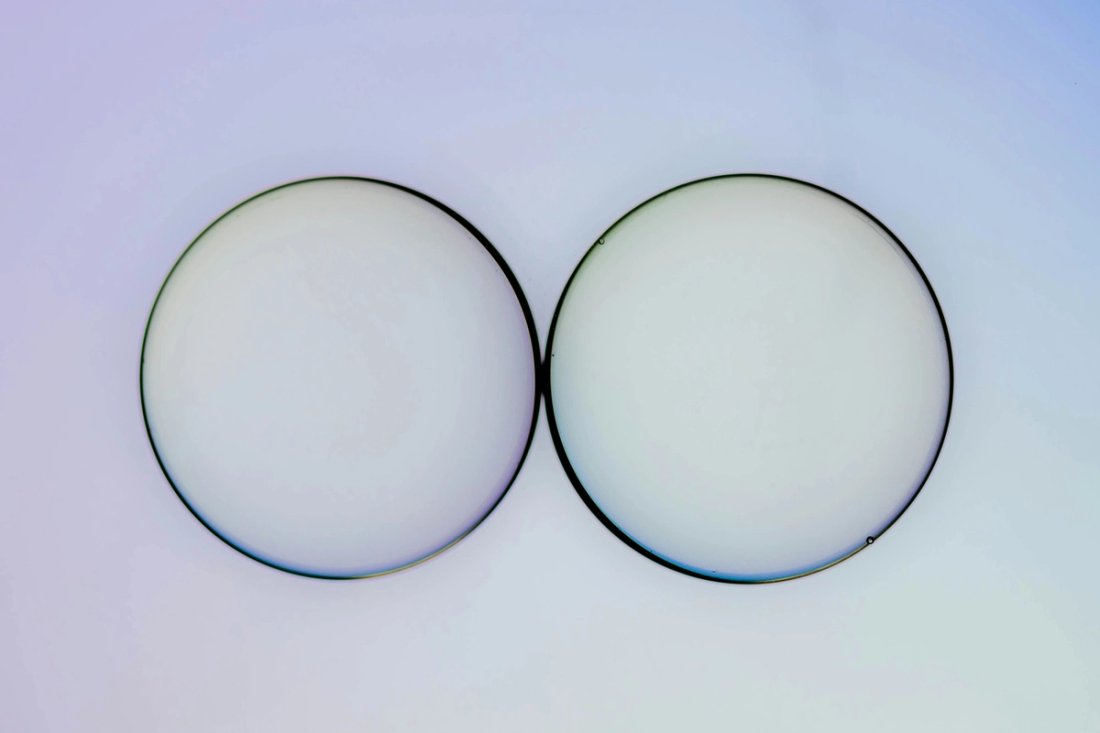 Two lenses on a white background.