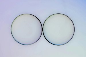 Two lenses on a white background.