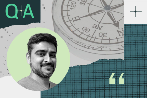Smiling man in a circular frame with a compass in the background, the text “Q+A” at the top left, and quotation marks on a teal grid pattern.