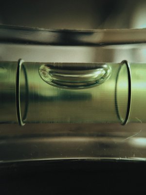 A bubble floats between two points in a green tube.