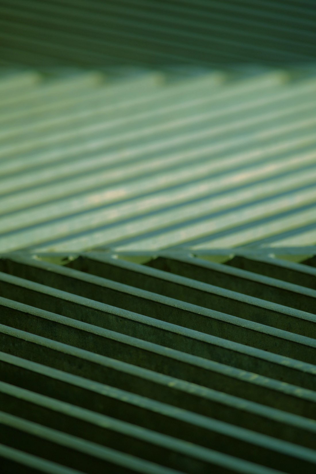 Green tinted grates in an alternating diagonal pattern.