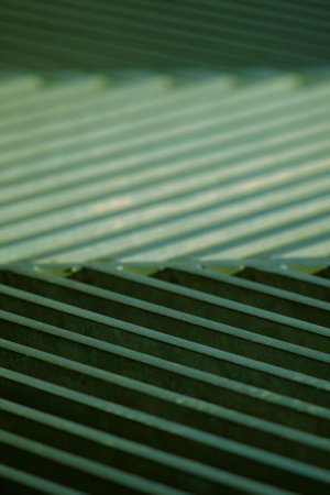 Green tinted grates in an alternating diagonal pattern.