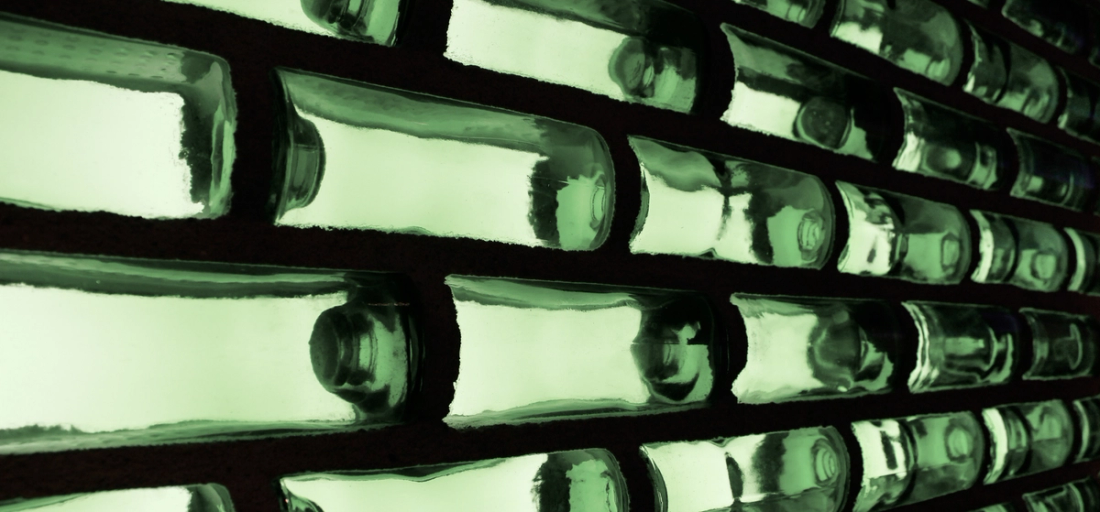 Abstract green glass blocks with black lines between them.