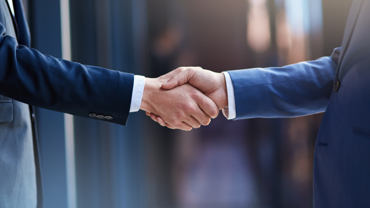 Two men shaking hands - symbol of building trust