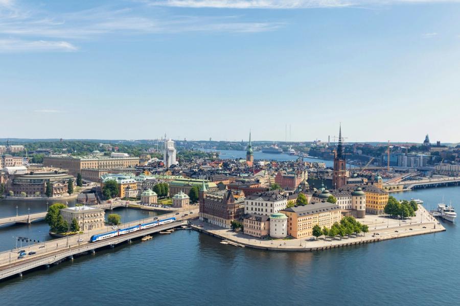 Stockholm waterfront, bridges and historic buildings under blue sky