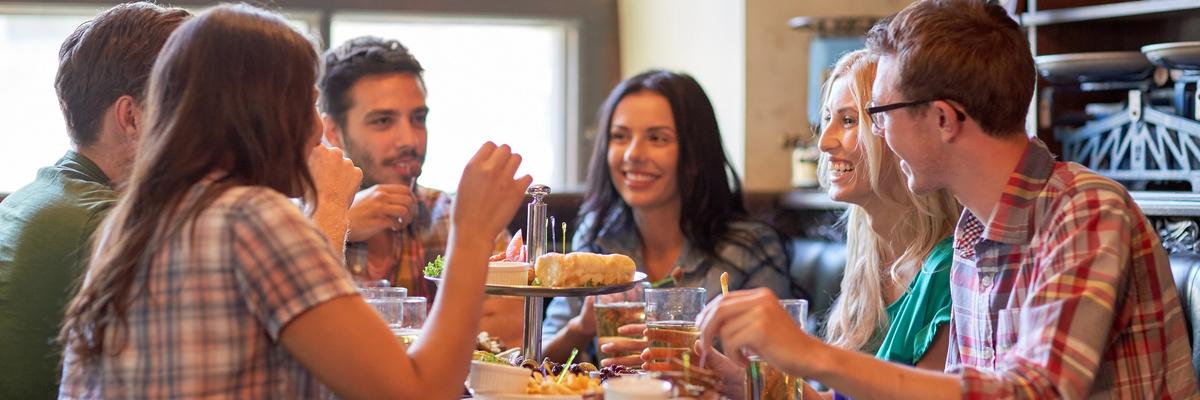 People enjoying a meal together at a restaurant in Utah.