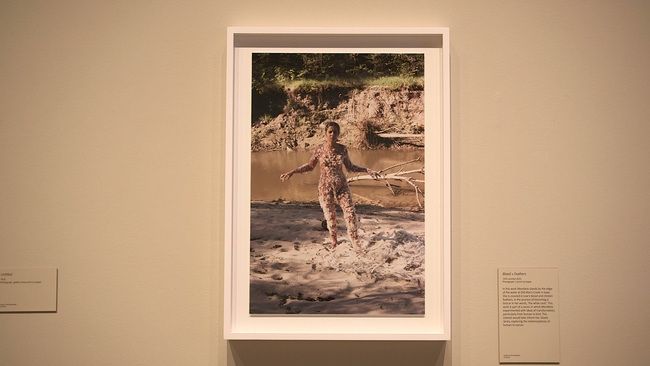 A photograph in the exhibition connects the artist’s body with mud and a riverbank