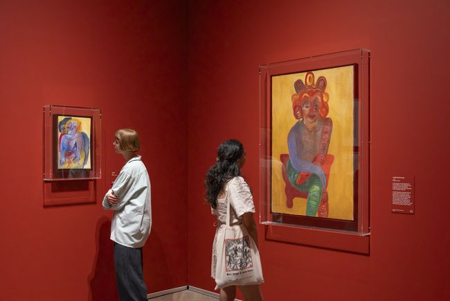 Visitors look at Mendieta’s early paintings
