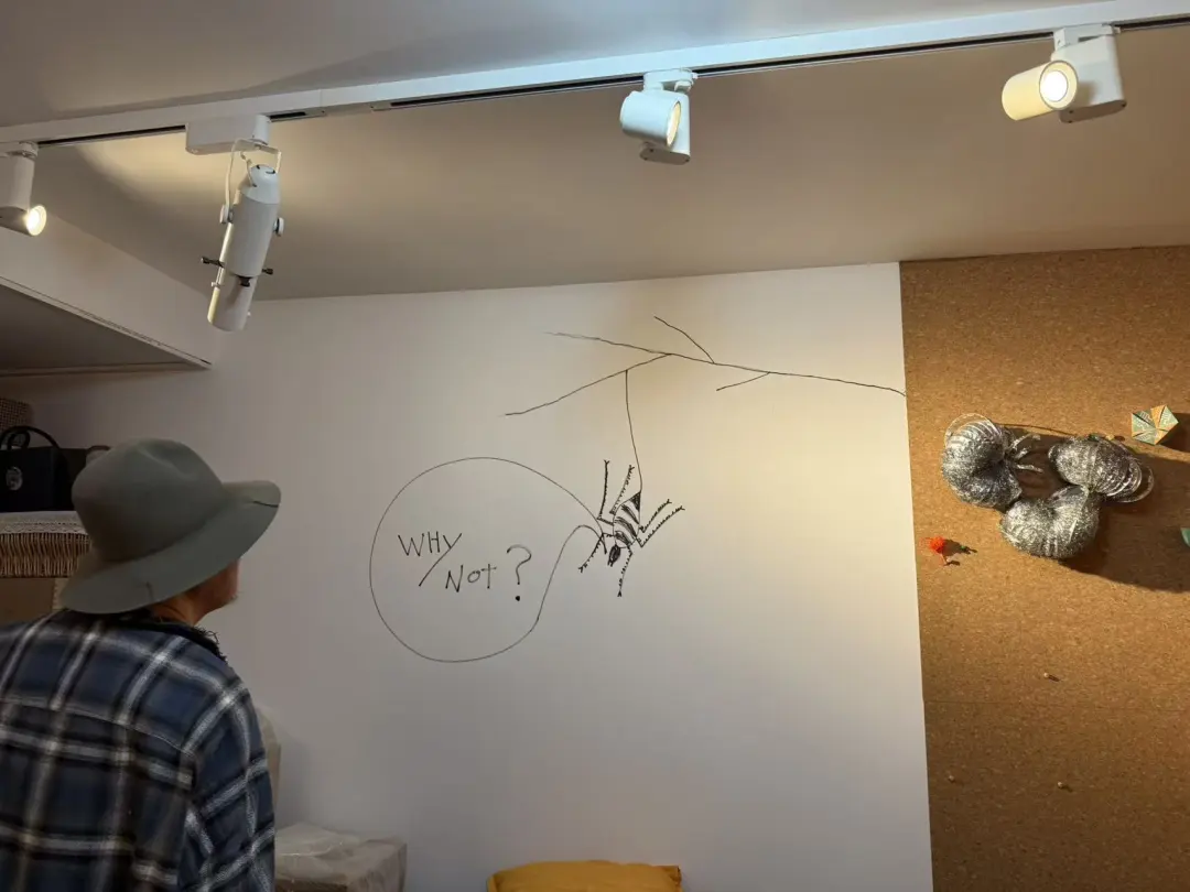The WHY NOT? wall drawing Kim Chang-il completed during the interview