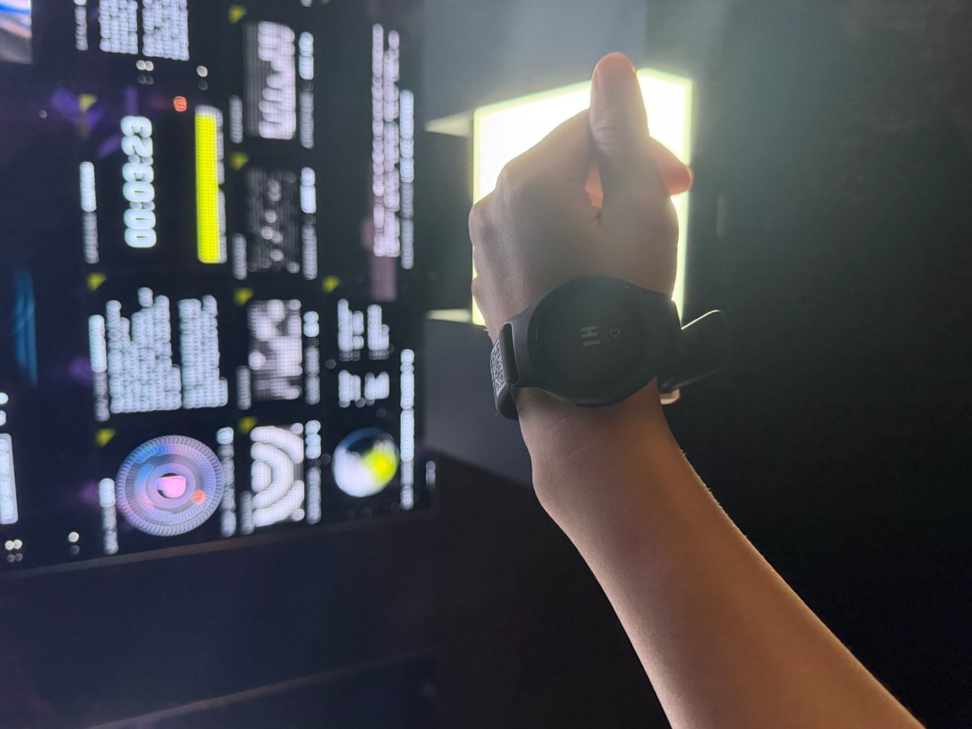 Visitor putting on a biometric wristband at Dataland’s entrance