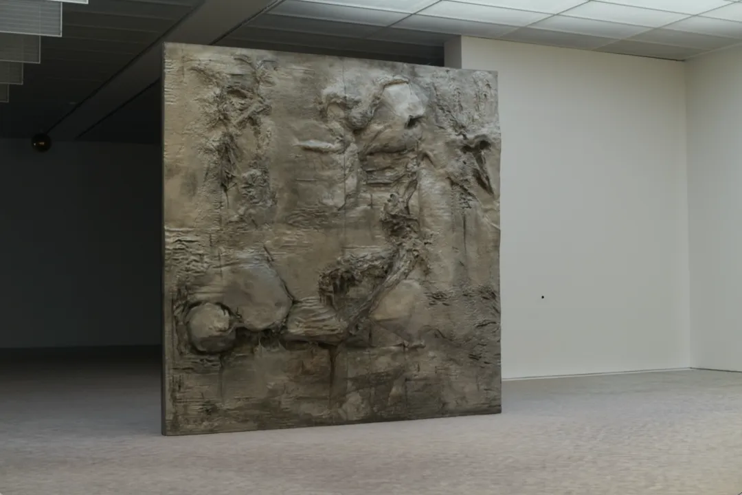 Relief forms on the monumental cast-aluminum door Adversary