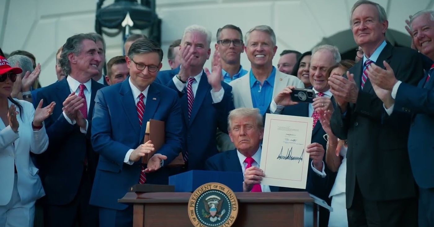 President Trump holds up the signed One Big Beautiful Bill on the South Lawn, surrounded by cheering lawmakers — the law that delivered No Tax on Tips (Official White House video still, “Americans across the country are thanking President Trump for delivering on No Tax on Tips,” posted Oct. 4, 2026)