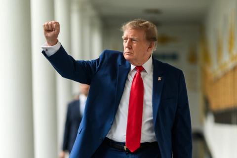 Stand-in photo (October 16, 2026): President Donald J. Trump raises his fist as he walks along the Colonnade of the White House, October 16, 2026 (Official White House Photo by Molly Riley / public domain)