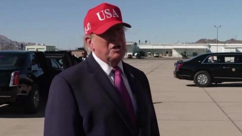 President Trump, in a red USA cap, answers reporters' questions on the tarmac in Bullhead City, Arizona, October 14, 2026 (still from Rapid Response 47 video)