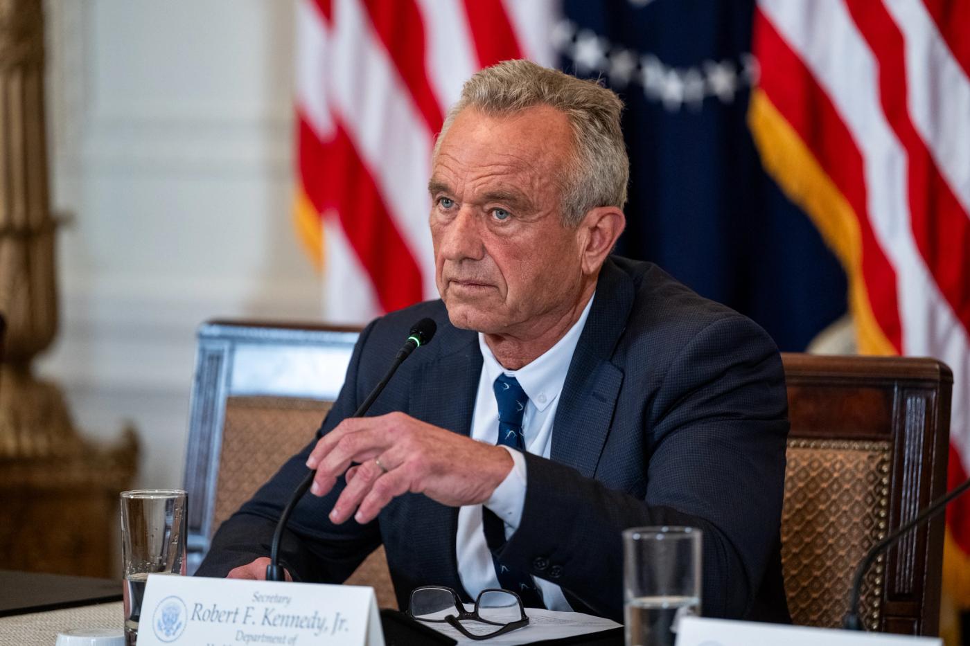 President Donald Trump delivers remarks from a White House podium announcing the Make America Healthy Again (MAHA) Commission. Official White House Photo (public domain).