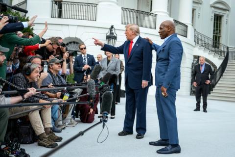 Stand-in photo (October 9, 2026): President Donald J. Trump speaks with members of the media alongside Mike Tyson before boarding Marine One on the South Lawn of the White House, Friday, October 9, 2026, en route to Joint Base Andrews for a trip to Syracuse, New York. (Official White House Photo by Joyce N. Boghosian)