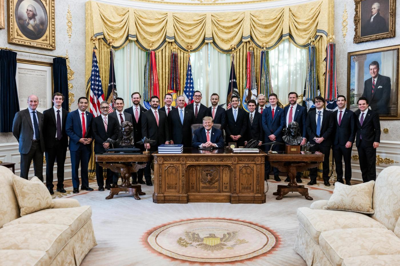 President Donald J. Trump at the Resolute Desk in the Oval Office with Vice President JD Vance and administration officials, October 20, 2026 (Official White House Photo by Joyce N. Boghosian / public domain)
