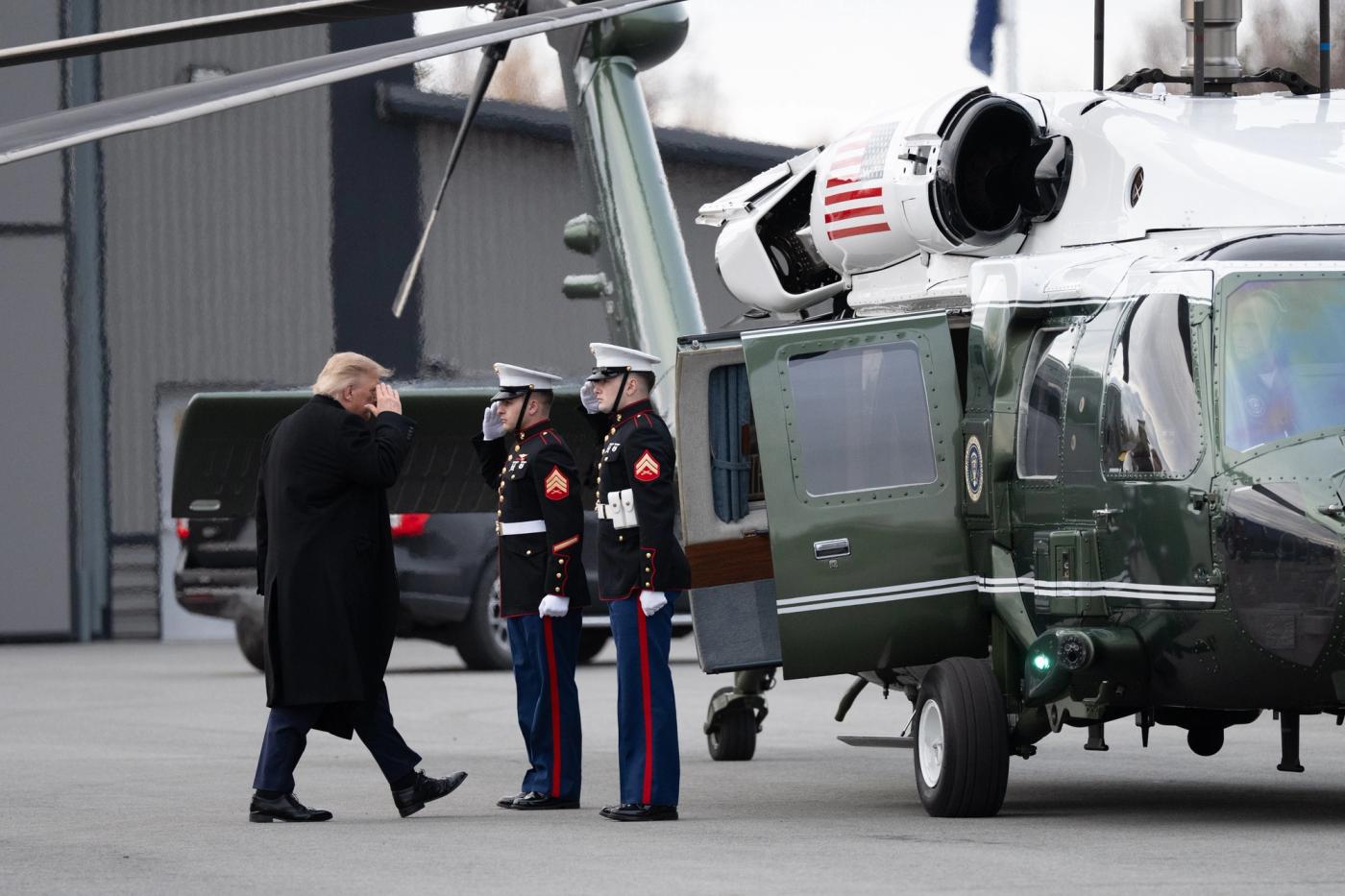 President Donald J. Trump walks past saluting Marines at Joint Base Elmendorf-Richardson, Anchorage, Alaska, October 13, 2026 (Official White House Photo by Molly Riley / public domain)