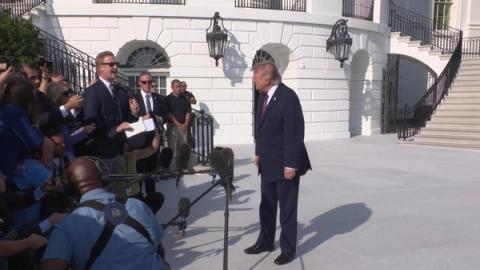 Interim: President Donald J. Trump speaks with the press on the South Lawn before departing the White House for Mobile, Alabama, Friday, October 2, 2026 (frame from the official White House video of the departure gaggle).