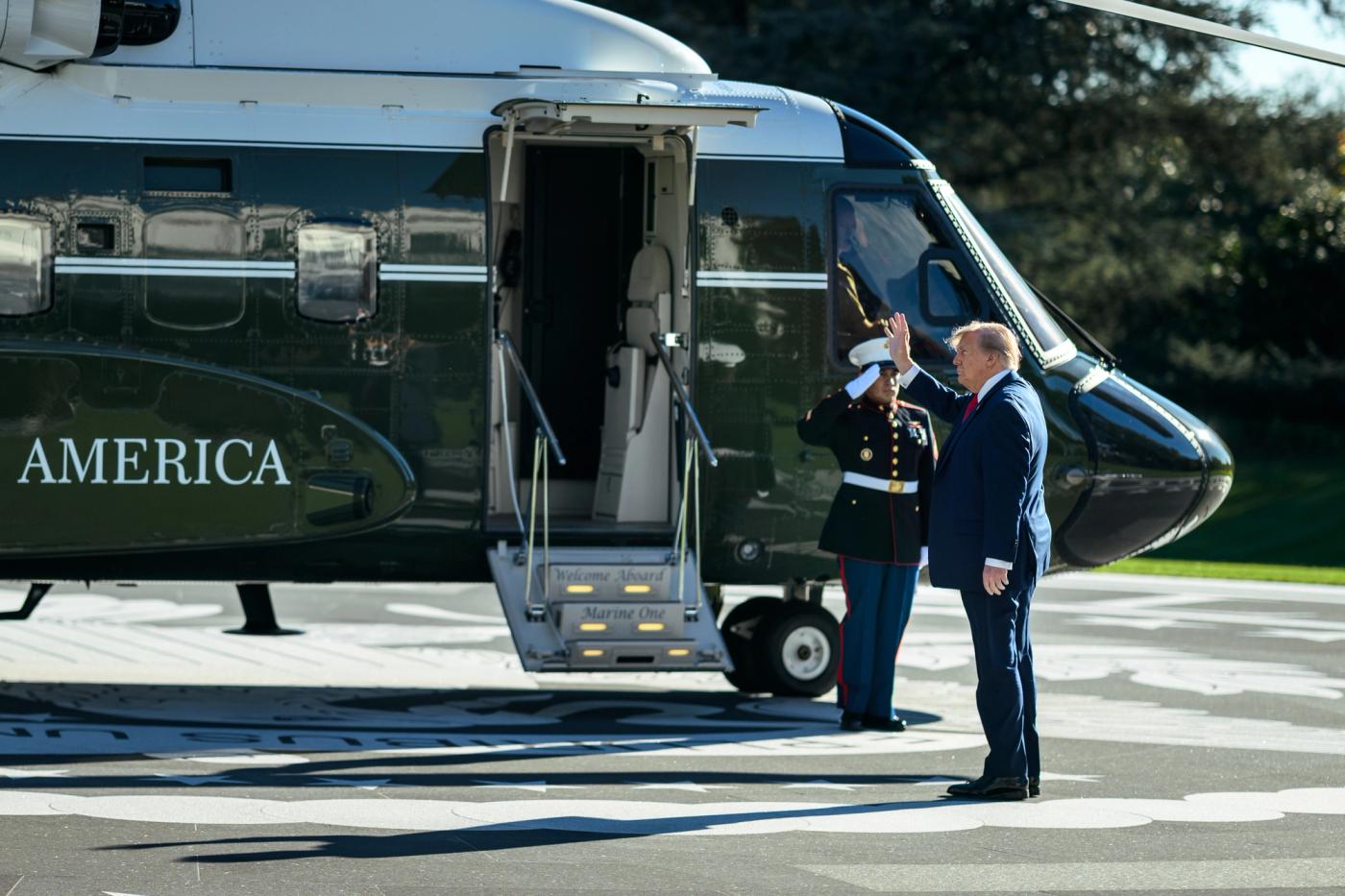 President Donald J. Trump salutes a Marine as he walks to Marine One on the South Lawn of the White House, October 21, 2026 (Official White House photo posted by @WhiteHouse / public domain)