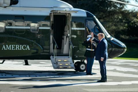 President Donald J. Trump salutes a Marine as he walks to Marine One on the South Lawn of the White House, October 21, 2026 (Official White House photo posted by @WhiteHouse / public domain)