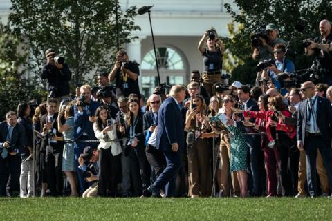 President Trump speaks with members of the media on the South Lawn of the White House before boarding Marine One, October 5, 2026 (Official White House Photo by Molly Riley)
