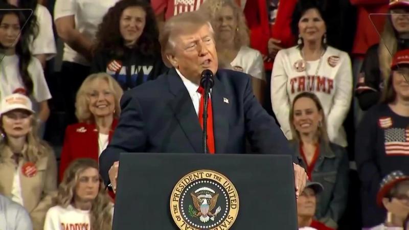 President Trump speaks at the presidential lectern about Obamacare refund checks and rural hospitals as supporters stand behind him at his rally in Tennessee, October 10, 2026 (still from Official White House video)