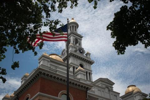 Stand-in photo (July 6, 2024): The Sevier County Courthouse in Sevierville, Tennessee, with the flag of the United States waving in the foreground (CC0 / public domain dedication)