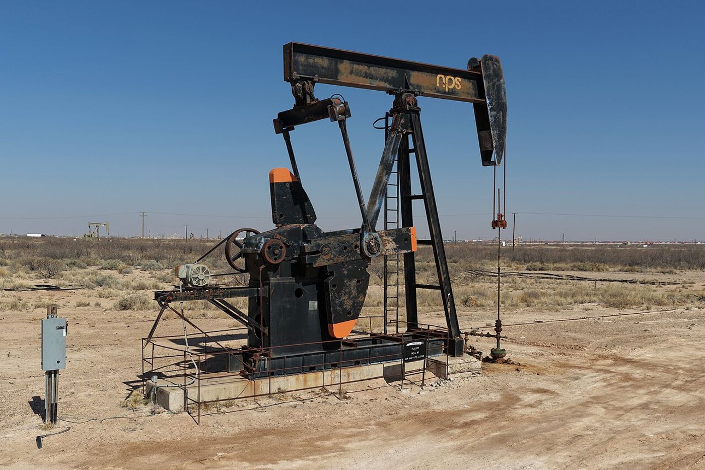 Oil infrastructure in the Permian Basin (Wikimedia Commons, CC BY-SA) — economic pressure campaign tightening on Iran.