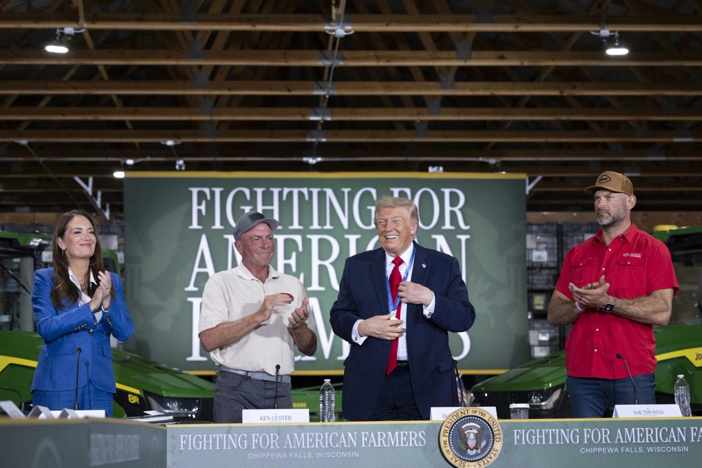 President Donald J. Trump stands with farmers at a roundtable in support of Wisconsin farmers at Custer Farms in Eau Claire, Wisconsin, June 5, 2026 (Official White House Photo by Joyce N. Boghosian / public domain)