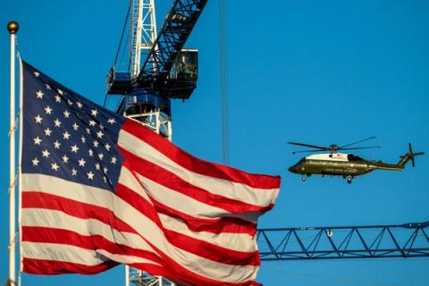 Stand-in photo (posted October 20, 2026): Marine One flies past an American flag (Official White House photo posted by @WhiteHouse)