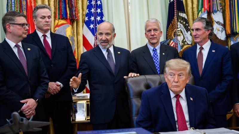 President Trump at the Resolute Desk with Commerce Secretary Howard Lutnick and Cabinet officials during the energy infrastructure announcement in the Oval Office, September 30, 2026 (Official White House photo)