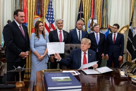 President Trump at the Resolute Desk holding a U.S. drug-price comparison chart during the Most Favored Nation pricing announcement for state Medicaid programs, Oval Office, September 18, 2026. Official White House Photo by Joyce N. Boghosian. Not a same-day still of the September 30, 2026 GLOBE Part B finalization.