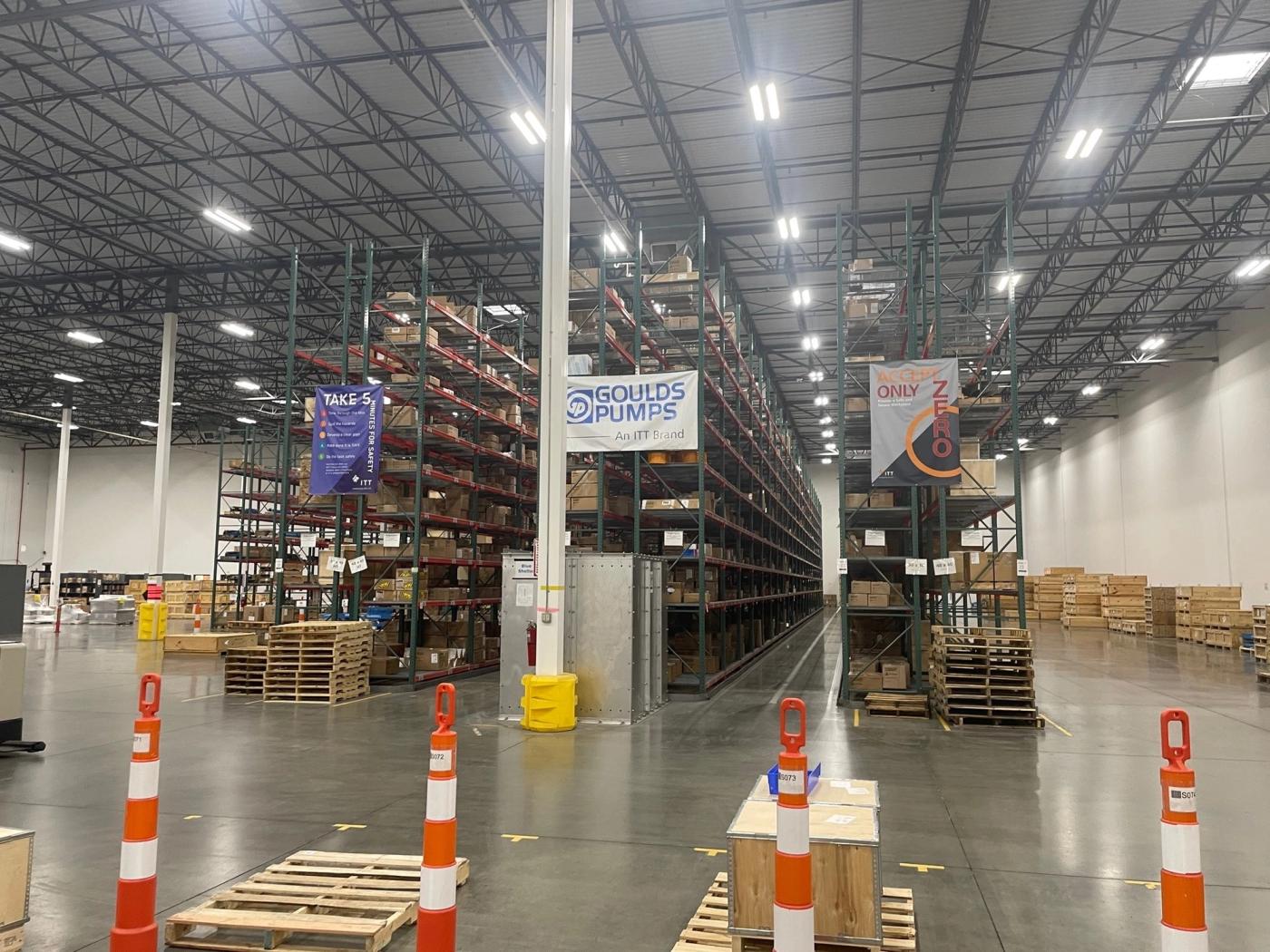 Warehouse shelving with a Goulds Pumps banner (Tennessee Department of Economic and Community Development photo)