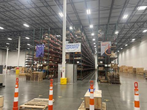 Warehouse shelving with a Goulds Pumps banner (Tennessee Department of Economic and Community Development photo)