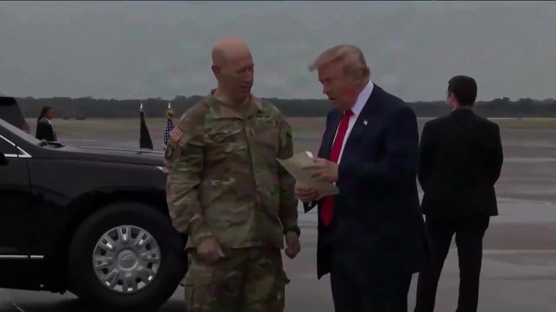 President Trump speaks with a U.S. Army soldier on the tarmac after arriving at Fort Campbell, October 10, 2026 (still from Official White House video)