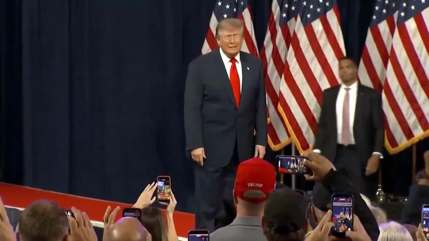President Trump takes the stage before American flags at his rally in Tennessee, October 10, 2026 (still from Official White House video)