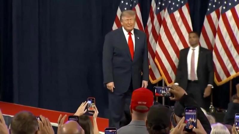 President Trump takes the stage before American flags at his rally in Tennessee, October 10, 2026 (still from Official White House video)