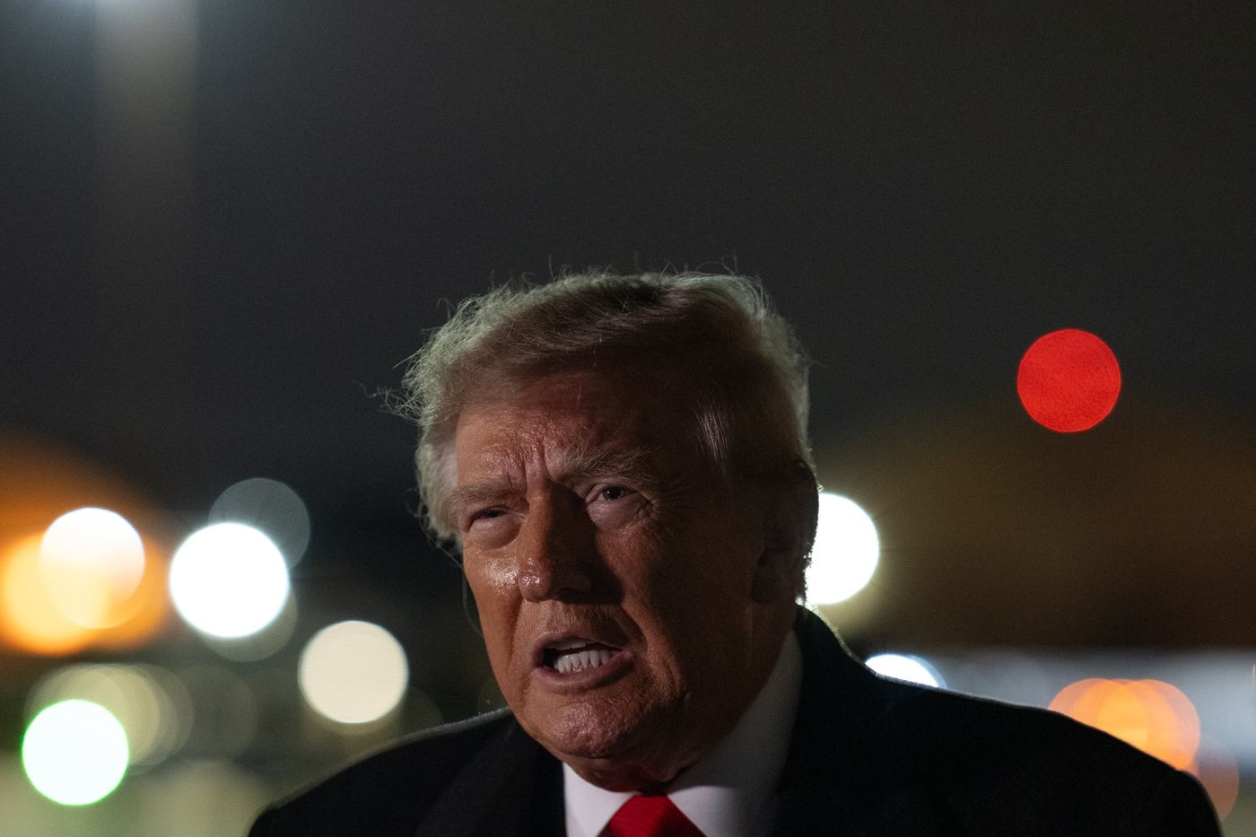 President Donald J. Trump speaks at night. (Official White House photo, Departure and Arrival gallery, October 10, 2026)