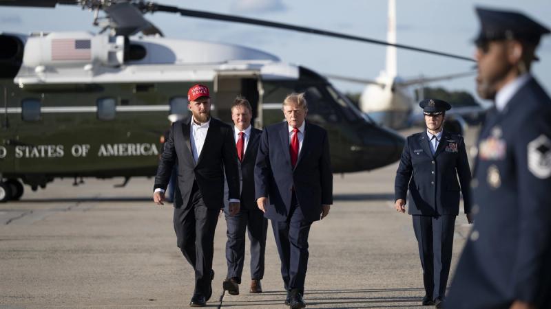 President Donald J. Trump disembarks Marine One at Joint Base Andrews, Maryland on Monday, October 12, 2026, with Jake Paul and boards Air Force One en route Youngstown, Ohio. (Official White House photo by Joyce N. Boghosian)