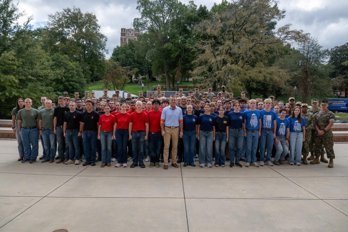 Secretary of War Pete Hegseth stands with new military recruits after administering the oath of enlistment at the University of Tennessee, Knoxville, October 17, 2026 (Department of War photo / public domain)