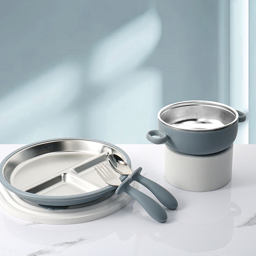Ergonomic silicone handle on baby silverware designed for toddler palmar grasp