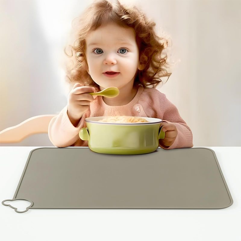 Raised spill-proof lip on waterproof toddler table protector mat