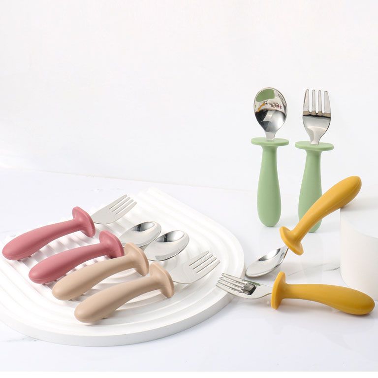 Safety anti choke barrier on stainless steel toddler feeding utensils
