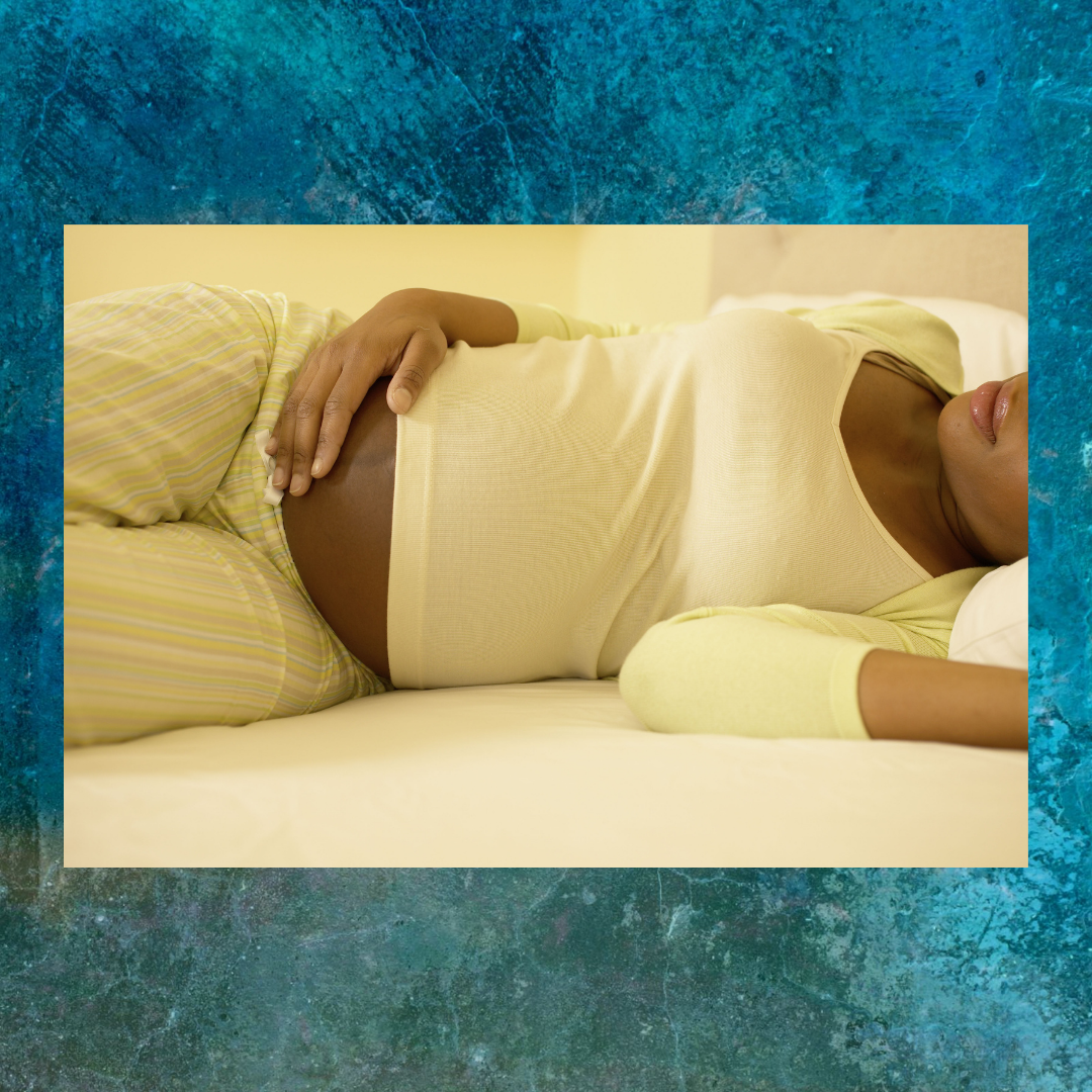 Pregnant woman resting on couch, blue water background.